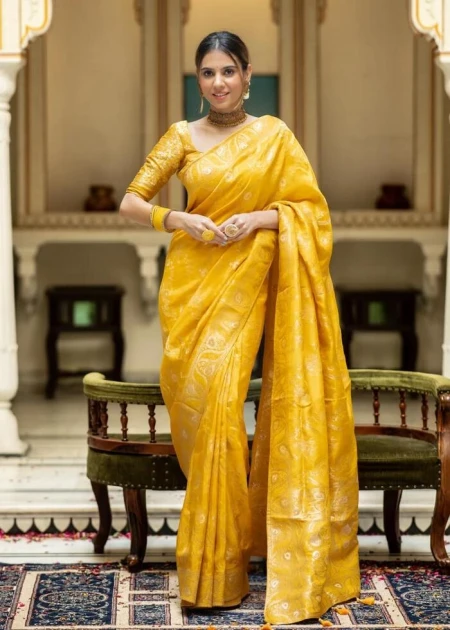 Yellow and silver gold-toned ethnic motifs woven design saree with woven design border